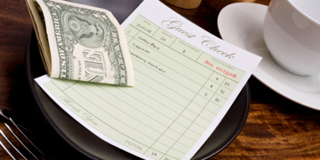 Guest check with cash in cafe