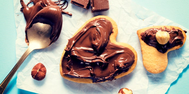 Sweet nougat cream on the heart shape cookies from above