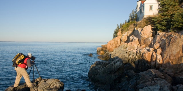This photographer shoots the Bass Harbor Head Light in Maine with a medium format film camera.