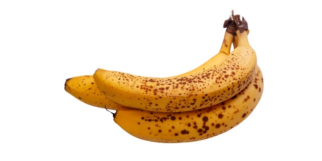 Overripe bananas isolated on white background