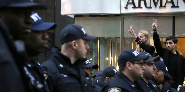 Demonstrators hold up the peace sign during a protest against President-elect Donald Trump in New York City near Trump Tower on Nov. 12, 2016.