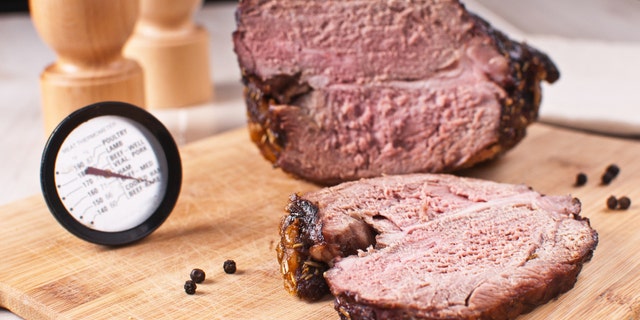 Roasted meat slice and thermometer
