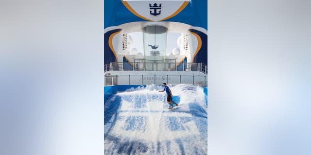 Surfing on the Anthem of the Seas, with the iFly in the background.