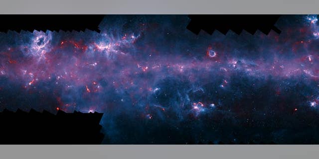 Image of the Milky Way in the direction of the constellation Scorpius with the NGC 6334 (Cat’s Paw Nebula, upper left) and the emission nebula RCW 120 (upper right). (ESO/APEX/ATLASGAL consortium/NASA/GLIMPSE consortium)