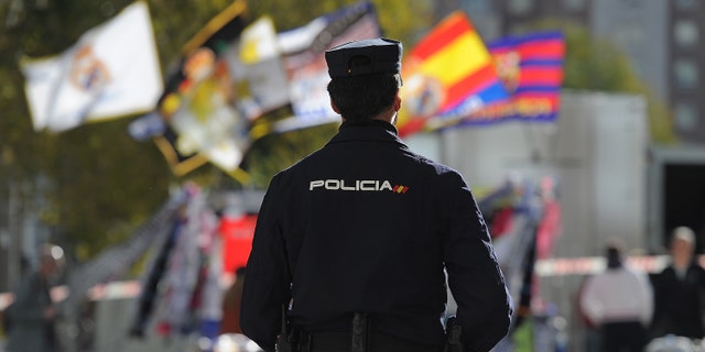 MADRID, SPAIN - NOVEMBER 21: A policeman stands guard outside the Santiago Bernabeu stadium during tight security ahead of the La Liga match between Real Madrid and Barcelona at Estadio Santiago Bernabeu on November 21, 2015 in Madrid, Spain. (Photo by Denis Doyle/Getty Images)