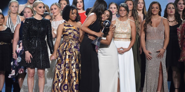 Jennifer Garner, front, embraces gymnast Aly Raisman after presenting the Arthur Ashe Award for Courage, at the ESPY Awards at Microsoft Theater on Wednesday, July 18 in Los Angeles.