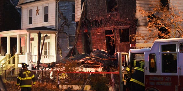 Baltimore City firefighters remain on the scene early Thursday