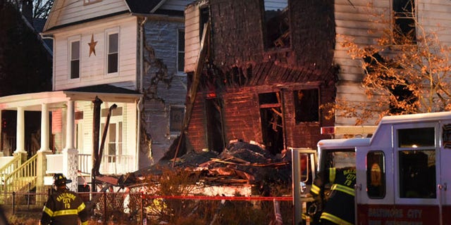 Baltimore City firefighters remain on the scene early Thursday