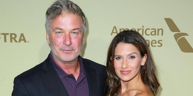 Alec Baldwin, left, and wife Hilaria welcome son Romeo on May 17.