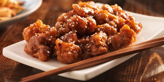 chinese sesame chicken with chopsticks