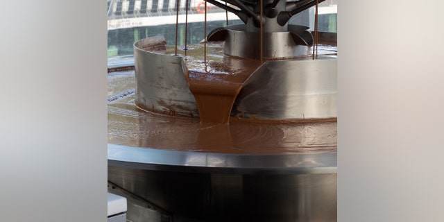 The Pouring chocolate in a chocolate factory