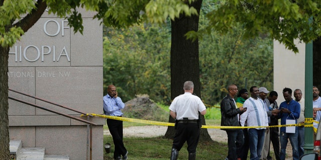 Sept. 29, 2014: A United States Secret Service policeman stands at the back of a police line tape near protestors at the Ethiopian Embassy in Washington.