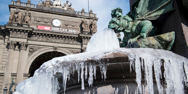 The icy Alfred Escher fountain is pictured in Zurich, Switzerland, Wednesday, Feb. 28, 2018.