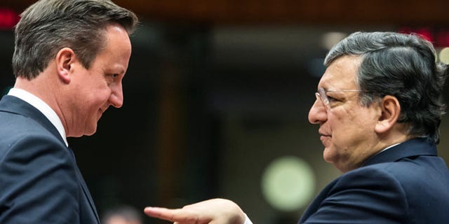 Mar. 20, 2014: European Commission President Jose Manuel Barroso, right, gestures while speaking with British Prime Minister David Cameron during a round table meeting an EU summit in Brussels.