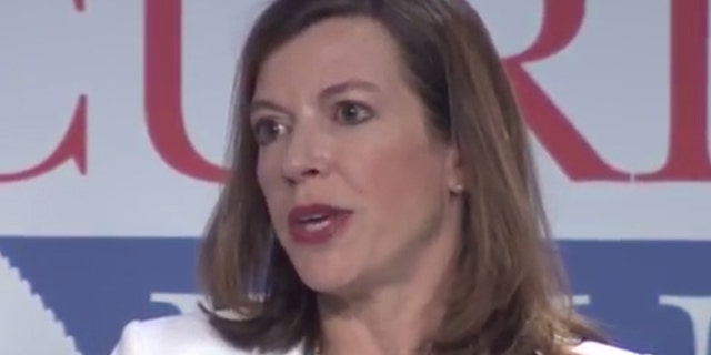 Evelyn Farkas, who left the Obama administration in 2015 after serving as Deputy Secretary of Defense, speaks on a podium at the Aspen Security Forum in Colorado.