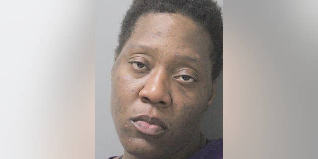 Evelyn Washington was charged with burglary after she was busted in another woman's home taking a bath and eating some Cheetos, police say.