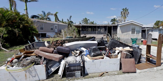 A pile of debris caused by a storm surge during Hurricane Irma, Sept. 18, 2017, in Everglades City, Fla.