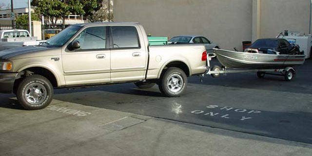 A boat and truck that belong to Scott Peterson. It was learned later in the case that he used the boat to transport Laci Peterson before she went missing.