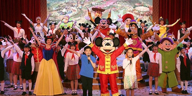 In this photo from 2011, Chinese children are shown performing with Disney actors to celebrate the ground-breaking of Shanghai Disneyland.