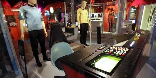 Costumes and pieces of the set of the "Star Trek" TV series are displayed in the exhibit, "Star Trek: Exploring New Worlds," as part of a 50th anniversary celebration of the TV show and films at the EMP Museum, in Seattle. The exhibit opens on Saturday.