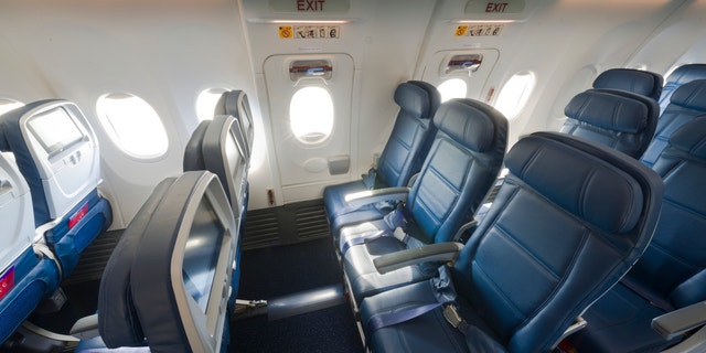 Main Cabin seats in the emergency exit rows inside a Boeing 737-900ER (739). - These images are protected by copyright. Delta has acquired permission from the copyright owner to the use the images for specified purposes and in some cases for a limited time. If you have been authorized by Delta to do so, you may use these images to promote Delta, but only as part of Delta-approved marketing and advertising. Further distribution (including proving these images to third parties), reproduction, display, or other use is strictly prohibited.