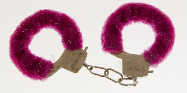 A pair of fuzzy handcuffs displayed at the original Museum of Broken Relationships in Zagreb, Croatia tossed aside by a former lover.