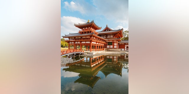 The Phoenix Hall of Byodo-in Temple in Kyoto, JapanKYOTO, JAPAN - OCTOBER 21: Byodoin Temple in Kyoto, Japan on October 21, 2014. Built in 998 AD during the Heian period, originally a private residence and converted into a temple by a member of the Fujiwara clan in 1052