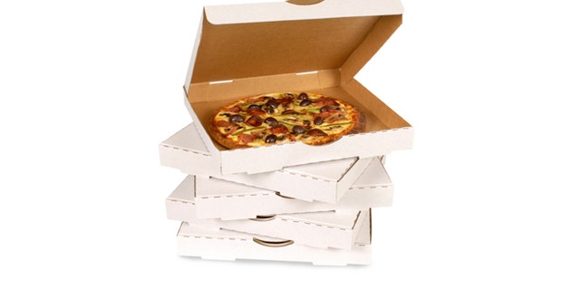 Pizza in plain open box isolated against white (clipping path provided).