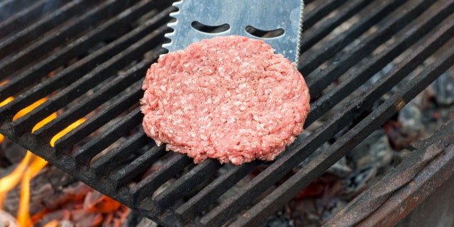 Flipping Hamburgers on the Grill with a Spatula