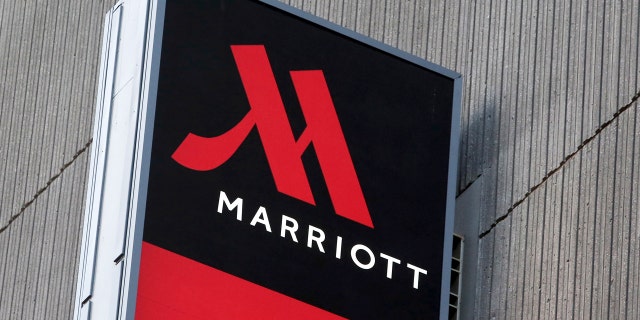 Signage for the New York Marriott Marquis is seen in Manhattan, New York, November 16, 2015. REUTERS/Andrew Kelly/File Photo - RTSOOZG