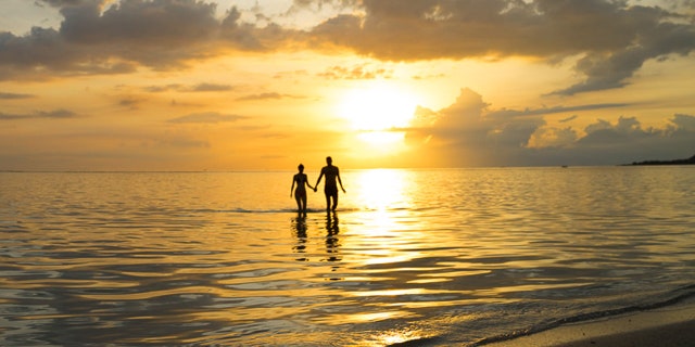 A serene sunset on the beach.