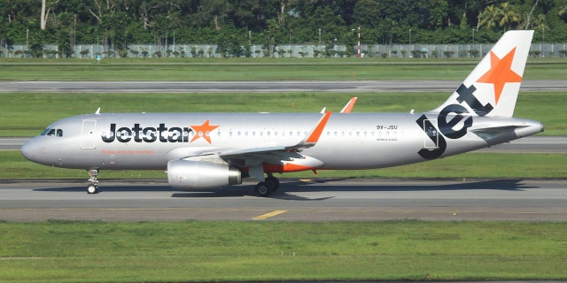 A mother celebrated the birth of her healthy newborn aboard a Jetstar Asia plane by naming her baby after the airline.