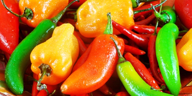 Festive bowl filled with a variety of hot peppers