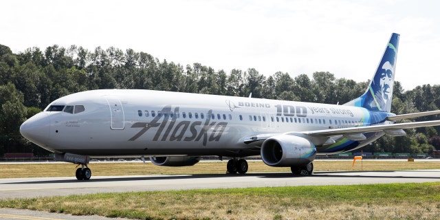 An Alaska Airlines plane is pictured with a paint job to mark the centennial of The Boeing Company in Seattle, Washington July 15, 2016. REUTERS/Jason Redmond - RTSI89G