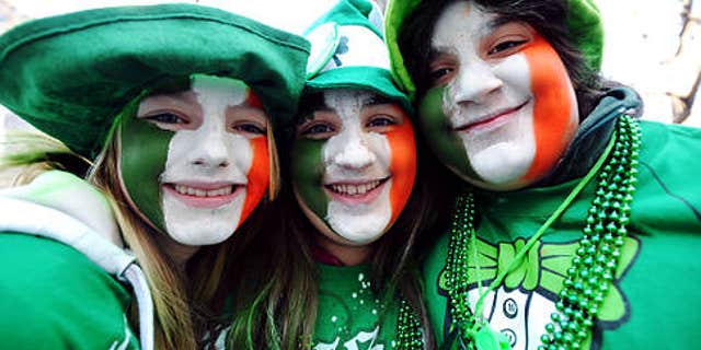 Annual St. Patrick's Day parade up Fifth Avenue in Manhattan -- siblings LEFT TO RIGHT Jessica, Sabrina and John Burke get into the spirit --- {Tuesday in Manhattan 3-17-09} Original Filename: DSC_8473x.JPG