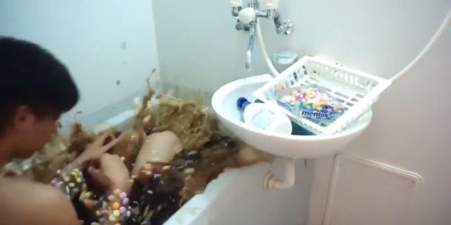 A brave man performs the ultimate fizzy feat.