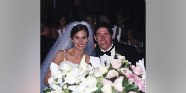 John and his wife on their wedding day.