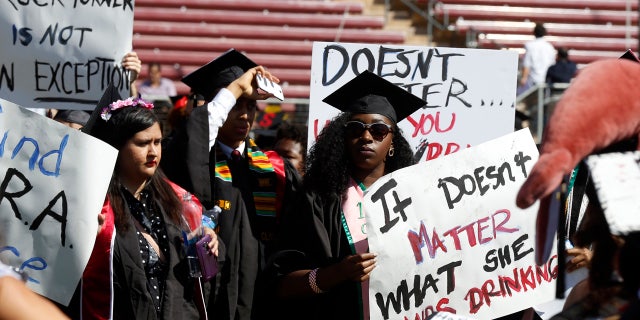 June 12, 2016: Protesters demonstrate during Stanford University graduation exercises at Stanford Stadium in Stanford, Calif.
