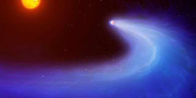 This artist's impression shows exoplanet GJ 436b, which is surrounded by a massive gas cloud that streams behind the planet like a comet's tail for millions of miles.
