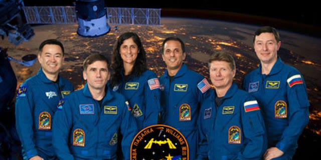 Pictured from the left are Flight Engineers Akihiko Hoshide, Yuri Malenchenko, Sunita Williams and Joe Acaba, Commander Gennady Padalka and Flight Engineer Sergei Revin.