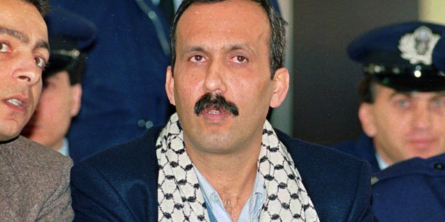 Dec. 12, 1991: Mohammed Rashed, center, convicted of the 1982 PanAm jetliner bombing, listens to his interpreter, left, during his appeals court hearing in Athens, Greece. When Rashed pleaded guilty in connection with the deadly 1982 explosion