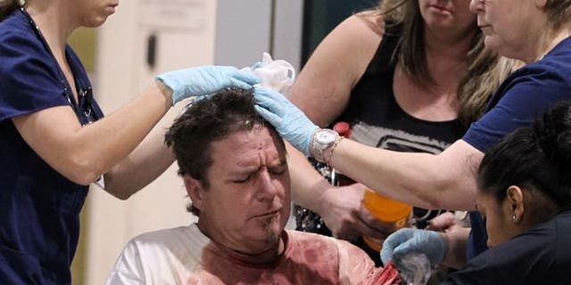 April 17, 2013: An unidentified man injured by the West fertilizer plant explosion is treated by nurses from Hillcrest Baptist Medical Hospital in Waco, Texas. (AP /Waco Tribune Herald)