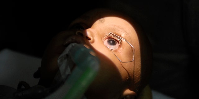 File photo - 15-month-old Tanishka has her eyes examined inside a operation theatre during a free treatment for poor patients to mark World Retinoblastoma Awareness week in the southern Indian city of Hyderabad May 12, 2010. Retinoblastoma is the most common primary ocular malignancy (eye cancer) of childhood, a doctor said. (REUTERS/Krishnendu Halder)