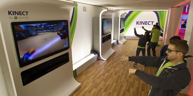 Gamers test out Microsoft's Xbox Kinect.