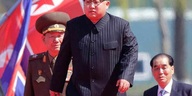 North Korean leader Kim Jong Un arrives for the official opening of the Ryomyong residential area in April.