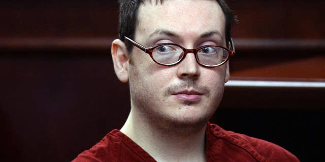 FILE - This Aug. 24, 2015 file photo James Holmes appears in court for the sentencing phase in his trial at Arapahoe County District Court in Centennial, Colo. Strangers from across the world sent Holmes money, photos and supportive letters during his three years in a county jail. Prosecutors this week released 200 pages worth of mail sent to Holmes in response to open-records requests made after his trial. Holmes was sentenced to life in prison without parole for murdering 12 people and trying to kill 70 more during the July 2012 massacre. (RJ Sangosti/The Denver Post via AP, Pool,File)