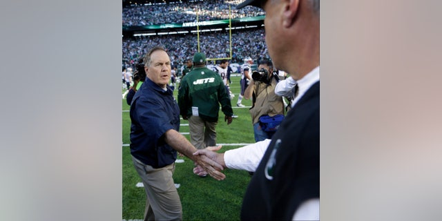 New England Patriots head coach Bill Belichick shakes hands with New York Jets head coach Rex Ryan after an NFL football game Sunday, Oct. 20, 2013 in East Rutherford, N.J. The Jets won the game 30-27. (AP Photo/Seth Wenig)