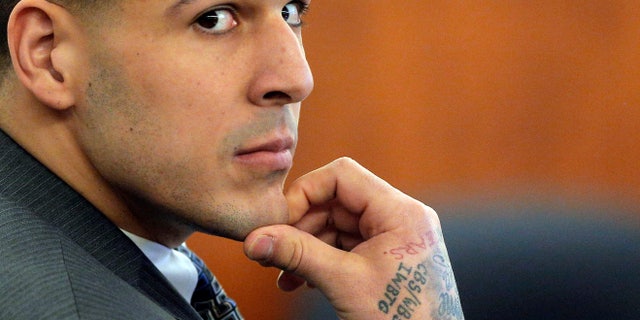 Former New England Patriots NFL football player Aaron Hernandez listens as prosecution witness Alexander Bradley testifies during his murder trial, Wednesday, April 1, 2015, at Bristol County Superior Court in Fall River, Mass. Hernandez is accused of killing Odin Lloyd in June 2013. (AP Photo/Brian Snyder, Pool)