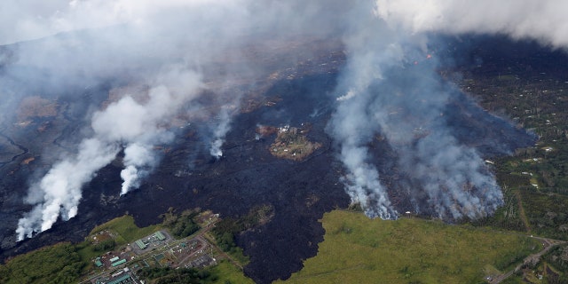Lava approaches Puna Geothermal Venture, bottom left, in the Leilani Estates near Pahoa, Hawaii, U.S., May 28, 2018.
