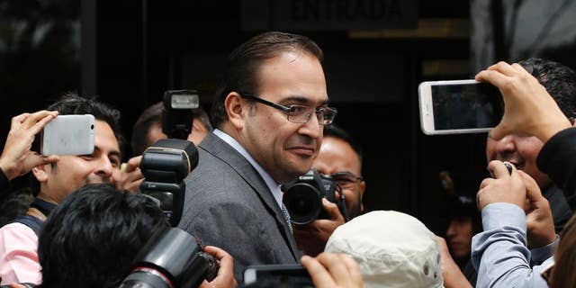 FILE - In this Aug. 5, 2016 file photo, outgoing Veracruz Gov. Javier Duarte arrives to the Attorney General's headquarters in Mexico City. The embattled outgoing governor of an eastern Mexico state who faces federal corruption investigations said Wednesday, Oct. 12, 2016 that he will ask the state legislature to leave almost two months before his term ends. (AP Photo/Marco Ugarte, File)
